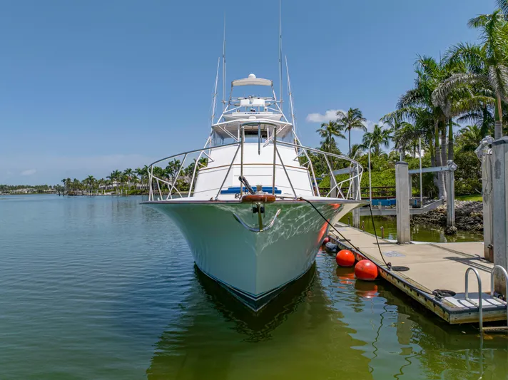 Vintage 1990 Yacht Photos Pics 1990 Buddy Davis 61 Convertible yacht docked in a tropical marina.