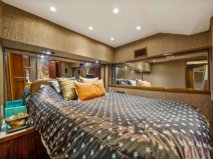 Vintage 1990 Yacht Photos Pics Luxurious bedroom interior of 1990 Buddy Davis 61 Convertible yacht with cozy bedding.