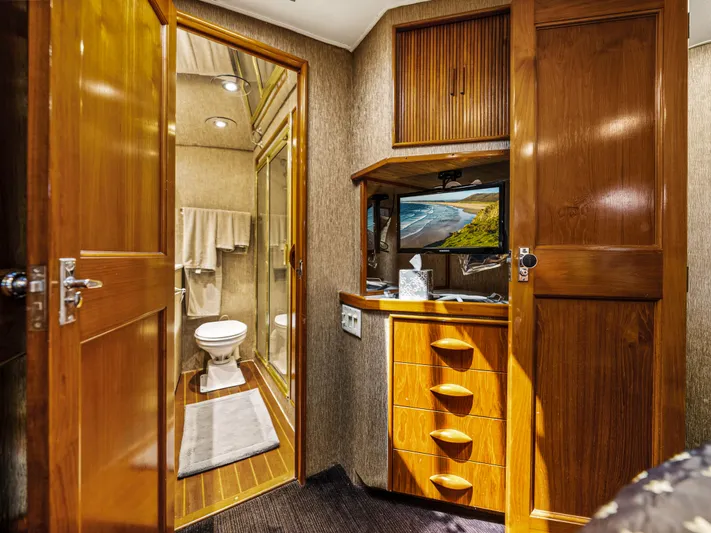 Vintage 1990 Yacht Photos Pics Interior of 1990 Buddy Davis 61 Convertible yacht with bathroom and wooden cabinetry.