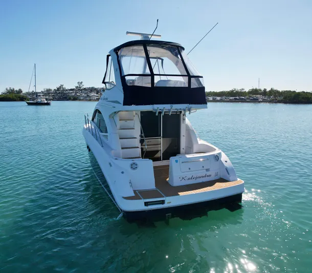  Yacht Photos Pics 2007 Sea Ray 360 Sedan Bridge yacht on calm water, rear view.