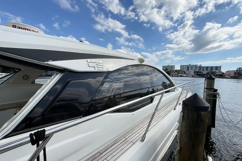  Yacht Photos Pics 2016 Azimut Atlantis 43 yacht docked by waterfront under blue sky.