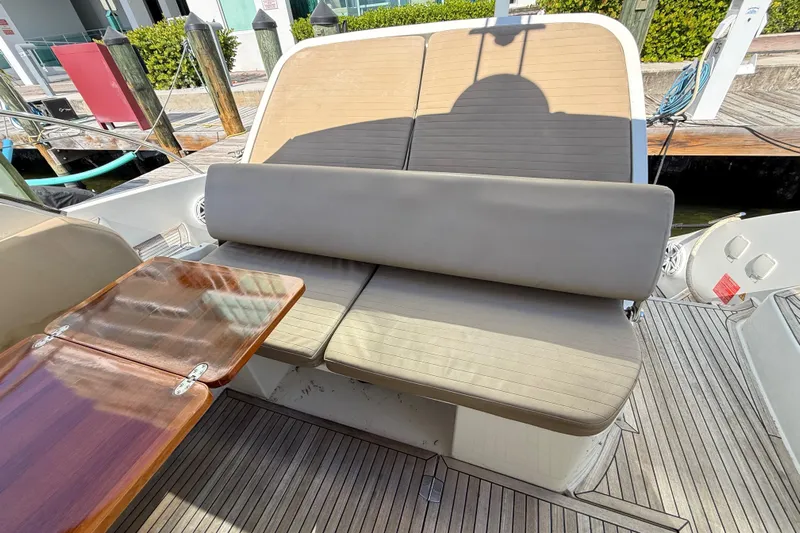  Yacht Photos Pics Azimut Atlantis 43 yacht 2016, featuring a comfortable outdoor seating area and wooden table.