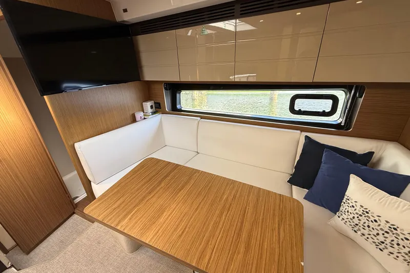  Yacht Photos Pics Luxurious interior of 2016 Azimut Atlantis 43 yacht with cozy seating and modern decor.