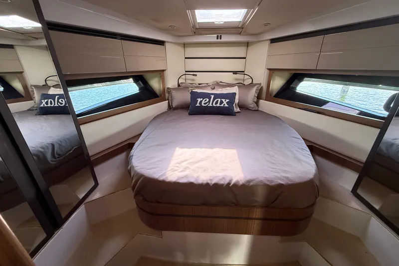  Yacht Photos Pics Luxurious bedroom interior of 2016 Azimut Atlantis 43 yacht with modern design and comfort.