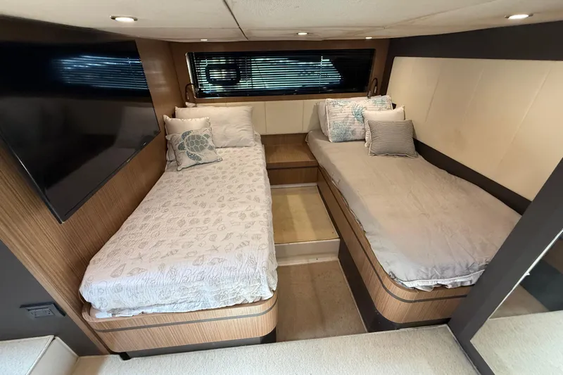  Yacht Photos Pics Interior of 2016 Azimut Atlantis 43 yacht with twin beds and modern decor.
