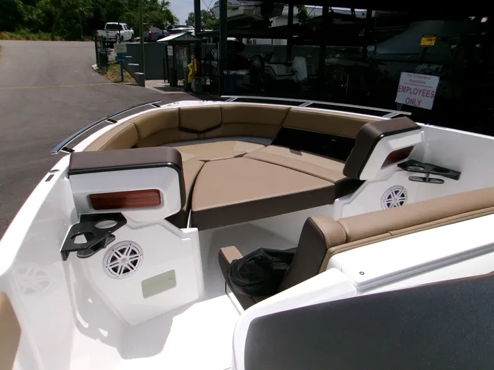  Yacht Photos Pics 2026 Monterey Elite 27 OB boat interior with tan seating and cup holders.