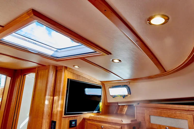 On Order, Ready For Customization Yacht Photos Pics Interior of 2027 Sabre 45 Salon Express with skylights and wood finish.