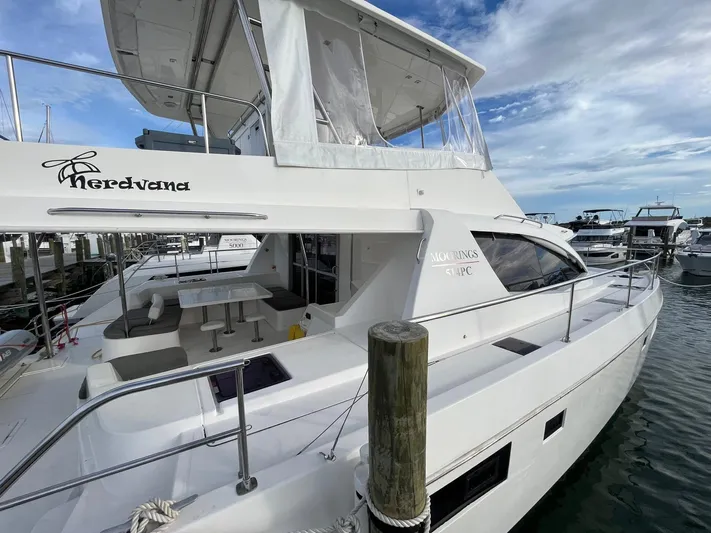 Nerdvana Yacht Photos Pics 2019 Leopard 51 Powercat docked at marina with clear skies.