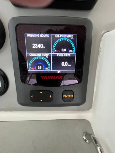Nerdvana Yacht Photos Pics Yanmar engine display on a 2019 Leopard 51 Powercat showing running hours, oil pressure, coolant temp, and fuel rate.
