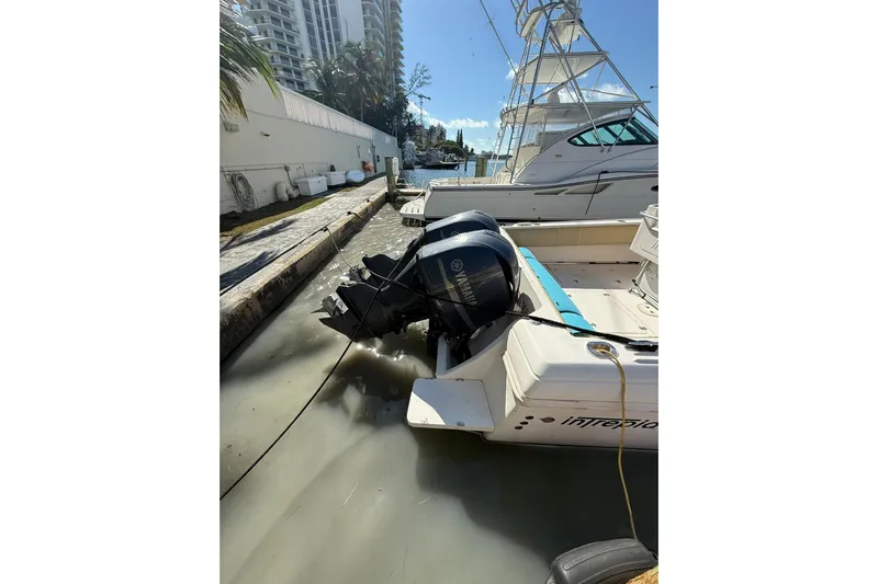  Yacht Photos Pics 2008 Intrepid 370 Cuddy boat docked with Yamaha outboard engines, urban backdrop.