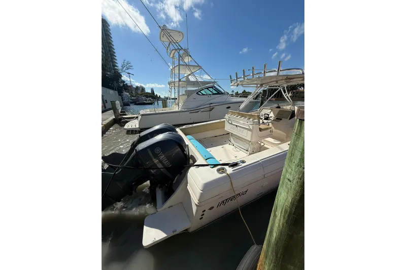  Yacht Photos Pics 2008 Intrepid 370 Cuddy boat docked, featuring Yamaha outboard engines under a clear blue sky.