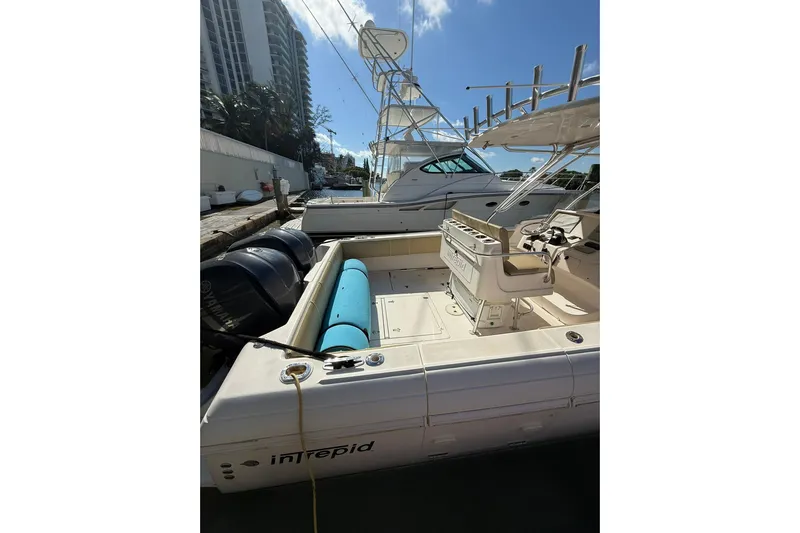  Yacht Photos Pics 2008 Intrepid 370 Cuddy boat docked, featuring spacious deck and powerful engines.