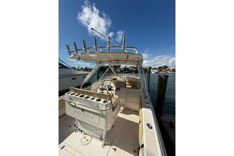  Yacht Photos Pics 2008 Intrepid 370 Cuddy boat docked under clear blue sky.