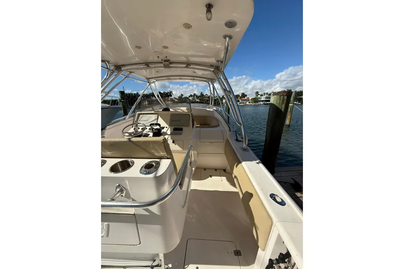  Yacht Photos Pics 2008 Intrepid 370 Cuddy boat interior with helm, seating, and water view.