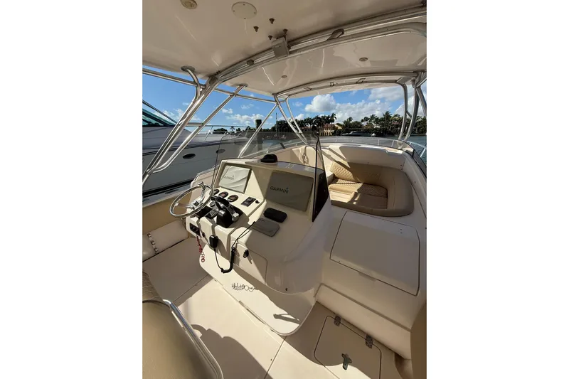  Yacht Photos Pics 2008 Intrepid 370 Cuddy boat interior with helm and seating area.