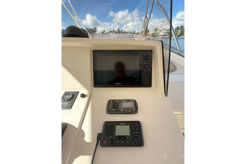  Yacht Photos Pics 2008 Intrepid 370 Cuddy helm with Garmin navigation system and clear sky view.