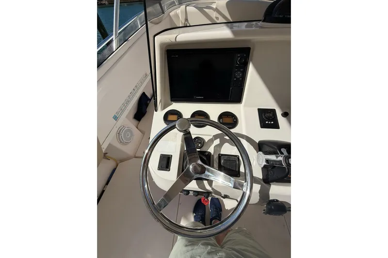  Yacht Photos Pics Steering console of a 2008 Intrepid 370 Cuddy boat with navigation controls.