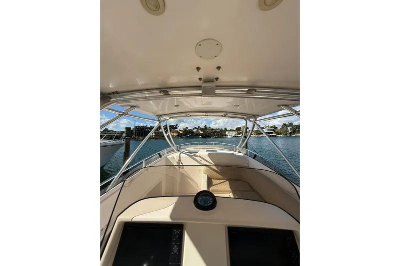 Yacht Photos Pics 2008 Intrepid 370 Cuddy boat interior with view of water and shoreline.