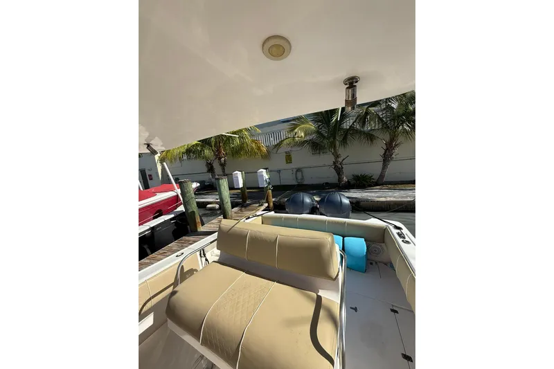  Yacht Photos Pics 2008 Intrepid 370 Cuddy boat interior with seating and dock view.