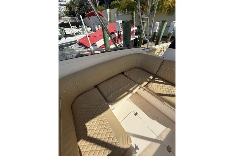  Yacht Photos Pics 2008 Intrepid 370 Cuddy boat interior with tan quilted seating.