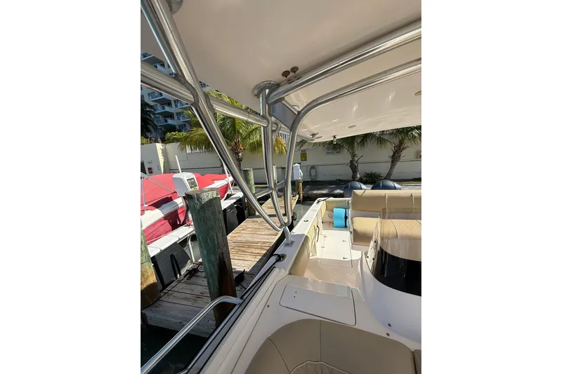  Yacht Photos Pics 2008 Intrepid 370 Cuddy boat interior with seating and dock view.