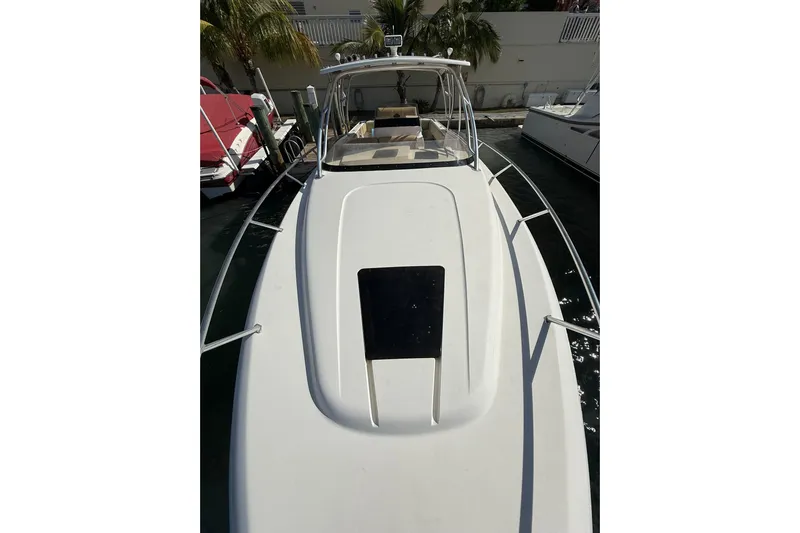  Yacht Photos Pics 2008 Intrepid 370 Cuddy boat docked, featuring sleek white deck and modern design.