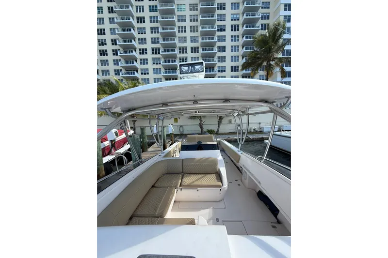  Yacht Photos Pics 2008 Intrepid 370 Cuddy boat docked near waterfront apartments.