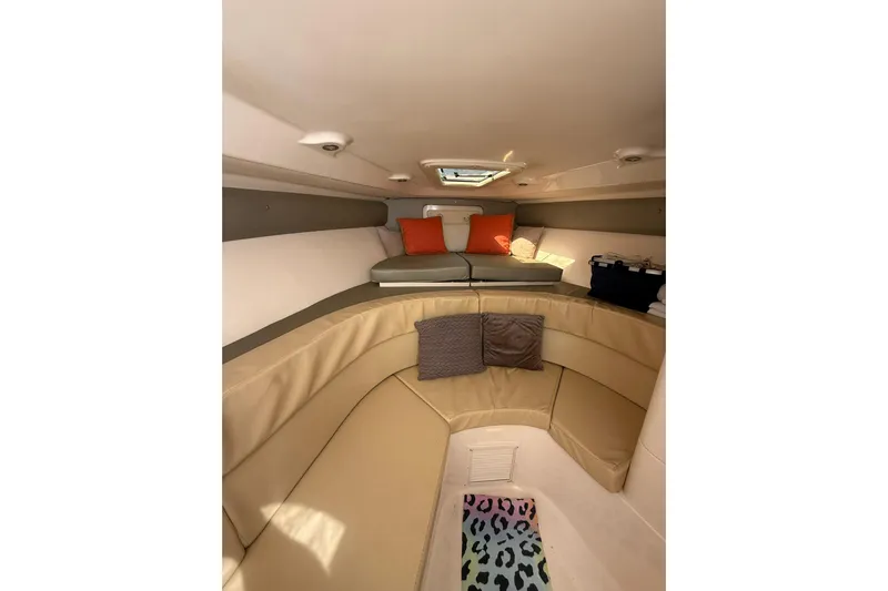  Yacht Photos Pics 2008 Intrepid 370 Cuddy cabin interior with beige seating and colorful accents.