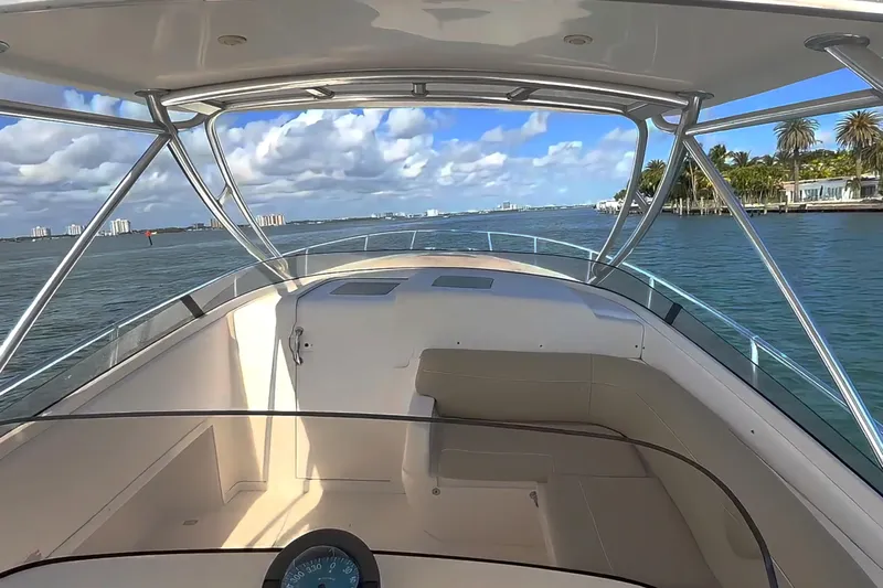  Yacht Photos Pics 2008 Intrepid 370 Cuddy cruising on a sunny day with scenic waterfront views.