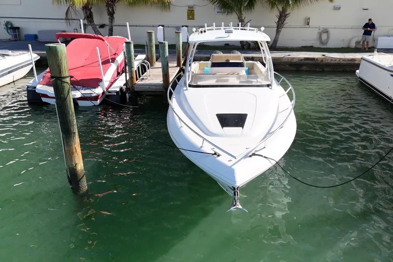  Yacht Photos Pics 2008 Intrepid 370 Cuddy boat docked in marina, front view.