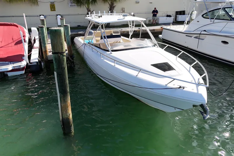  Yacht Photos Pics 2008 Intrepid 370 Cuddy boat docked in marina, side view.