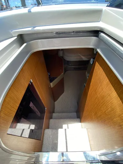  Yacht Photos Pics Interior view of 2006 Riva RAMA 44' yacht, featuring wooden stairs and modern design.