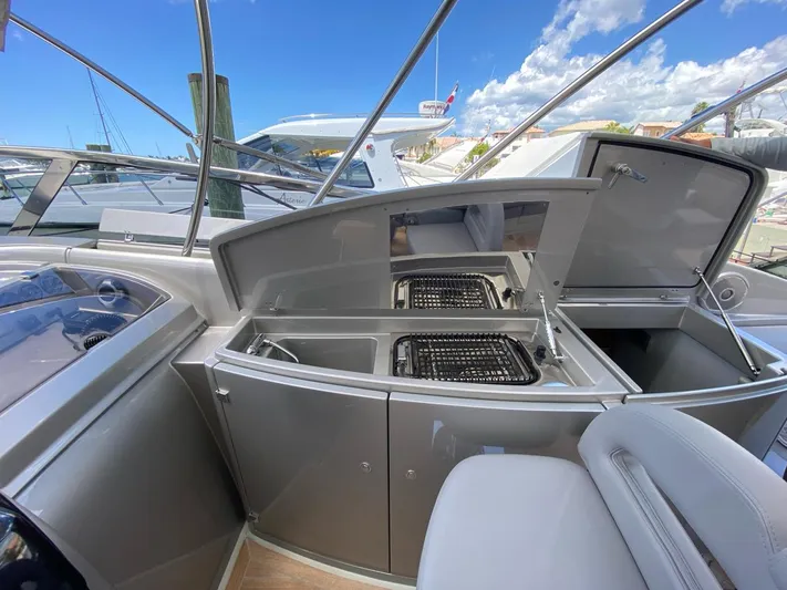  Yacht Photos Pics Interior view of 2006 Riva RAMA 44' yacht with open storage compartments.