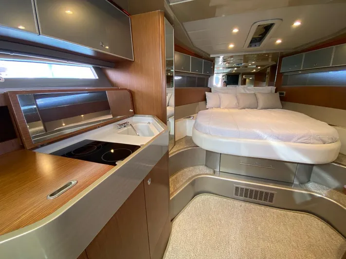  Yacht Photos Pics Luxurious interior of 2006 Riva RAMA 44' yacht with modern kitchen and cozy bedroom.