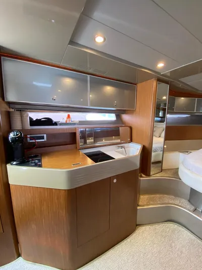  Yacht Photos Pics Interior of 2006 Riva RAMA 44' yacht with modern kitchen and sleek wood finishes.