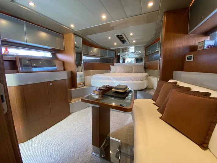  Yacht Photos Pics Luxurious interior of a 2006 Riva RAMA 44' yacht with elegant wood finishes and plush seating.