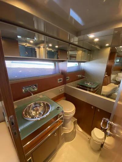  Yacht Photos Pics Luxurious bathroom in 2006 Riva RAMA 44' yacht with modern fixtures and elegant design.