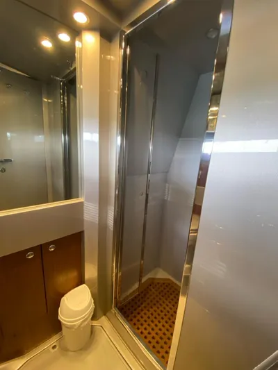  Yacht Photos Pics Bathroom interior of a 2006 Riva RAMA 44' yacht, featuring a shower and toilet.