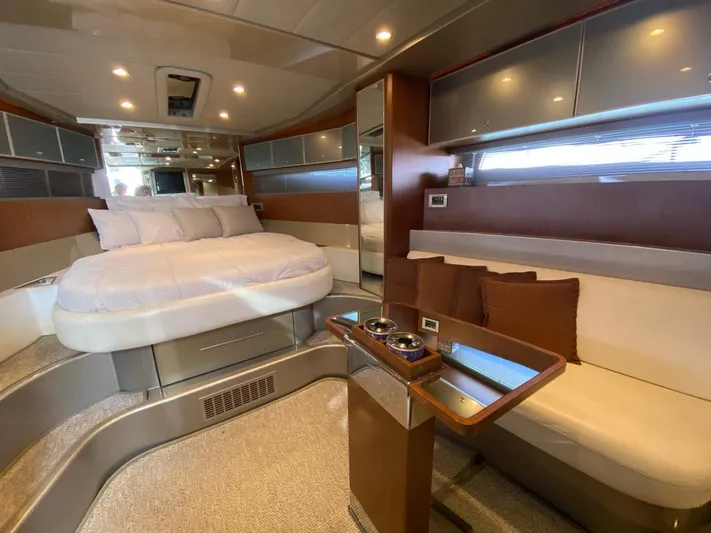  Yacht Photos Pics Luxurious interior of 2006 Riva RAMA 44' yacht with bed and seating area.
