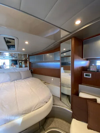  Yacht Photos Pics Luxurious interior of 2006 Riva RAMA 44' yacht with modern design and cozy bedding.