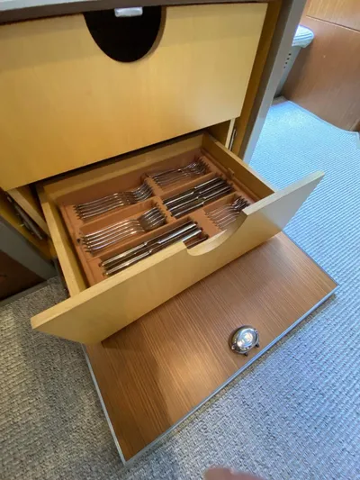  Yacht Photos Pics Open drawer with organized cutlery on a 2006 Riva RAMA 44' yacht.