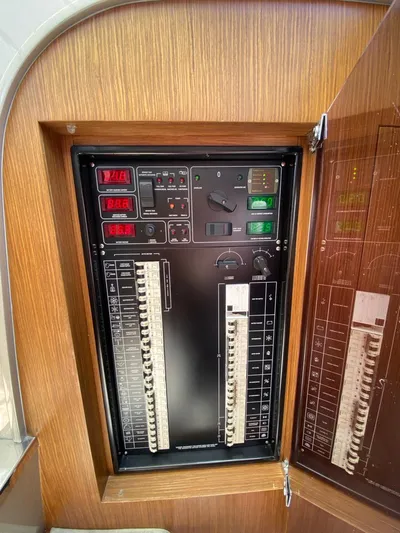 Yacht Photos Pics Electrical panel of a 2006 Riva RAMA 44' yacht, featuring circuit breakers and control switches.