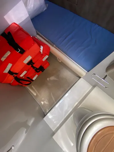  Yacht Photos Pics Interior of 2006 Riva RAMA 44' boat with life jackets and blue mattress.