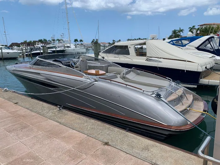  Yacht Photos Pics 2006 Riva RAMA 44' luxury yacht docked at marina under blue sky.