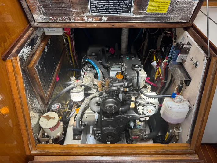 Mast Transit Yacht Photos Pics Engine compartment of a 1983 Hinckley Sou'wester 42 sailboat, showcasing mechanical components.