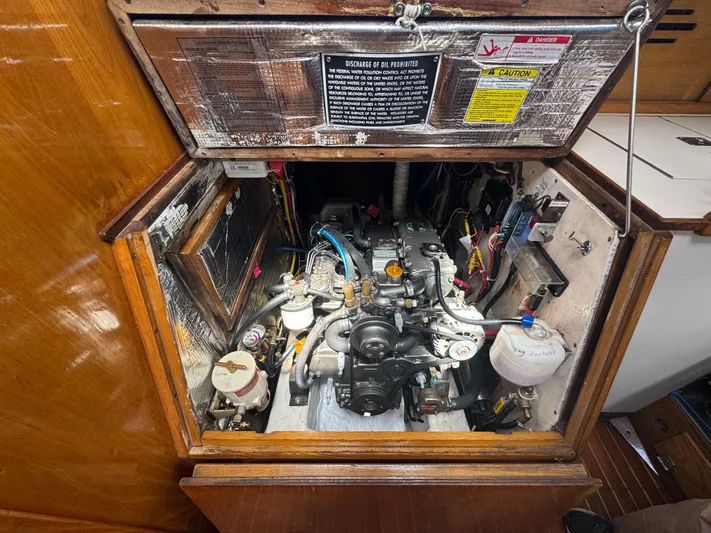 Mast Transit Yacht Photos Pics Engine compartment of a 1983 Hinckley Sou'wester 42 sailboat, showcasing detailed mechanical components.