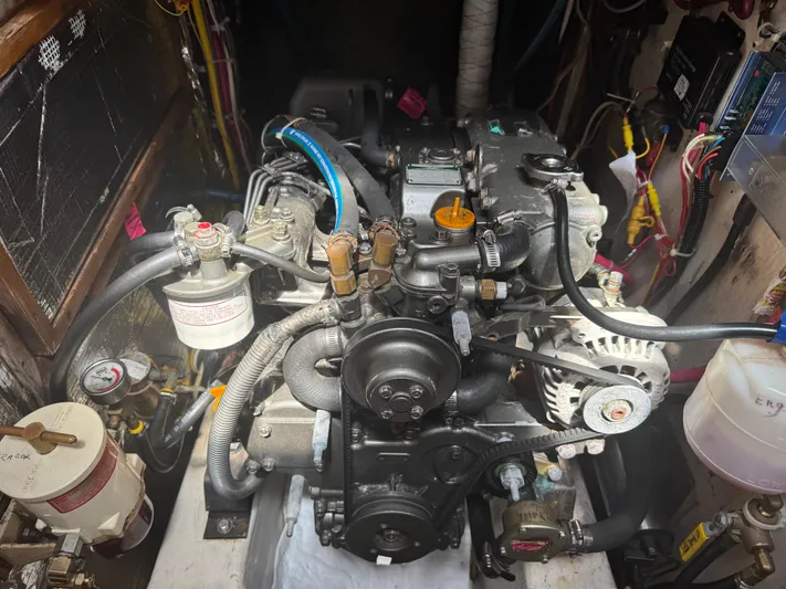 Mast Transit Yacht Photos Pics Engine compartment of a 1983 Hinckley Sou'wester 42 sailboat, showcasing mechanical components and wiring.