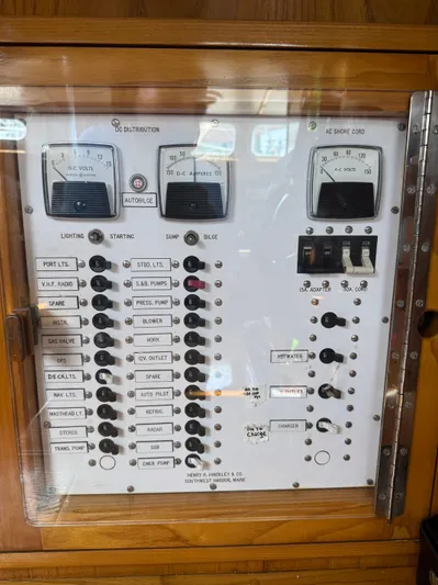 Mast Transit Yacht Photos Pics Electrical control panel on a 1983 Hinckley Sou'wester 42 sailboat, featuring various switches and gauges.