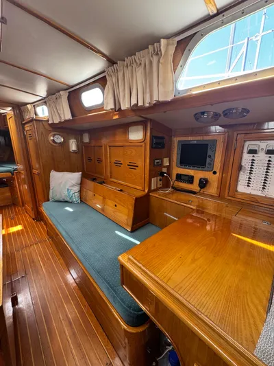 Mast Transit Yacht Photos Pics Interior of 1983 Hinckley Sou'wester 42 sailboat with wooden finish and navigation equipment.