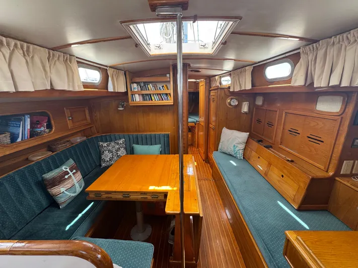 Mast Transit Yacht Photos Pics Interior of 1983 Hinckley Sou'wester 42 sailboat with wood finish and cozy seating area.